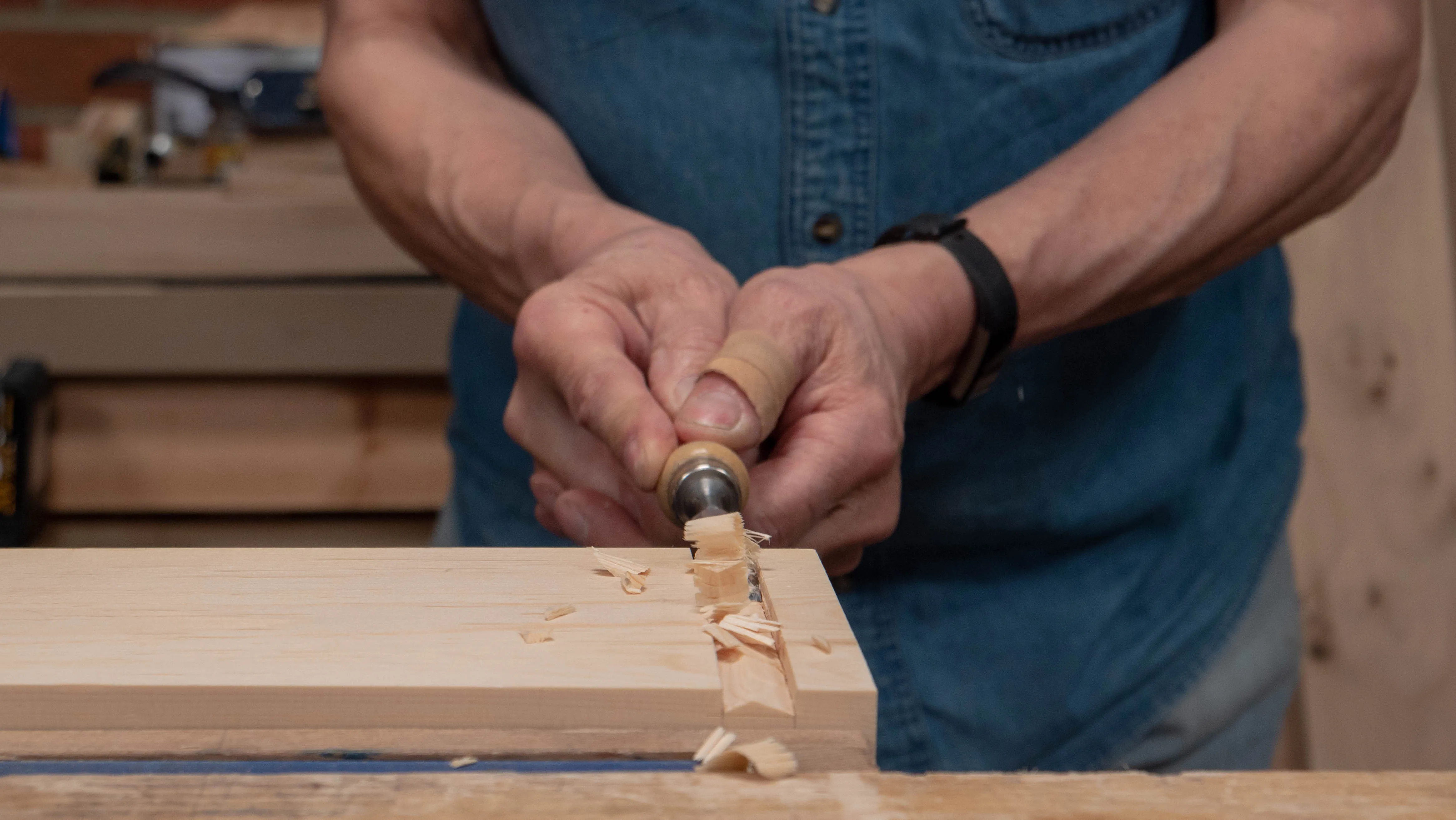 Pare across the recess with a narrower chisel until you're close to depth