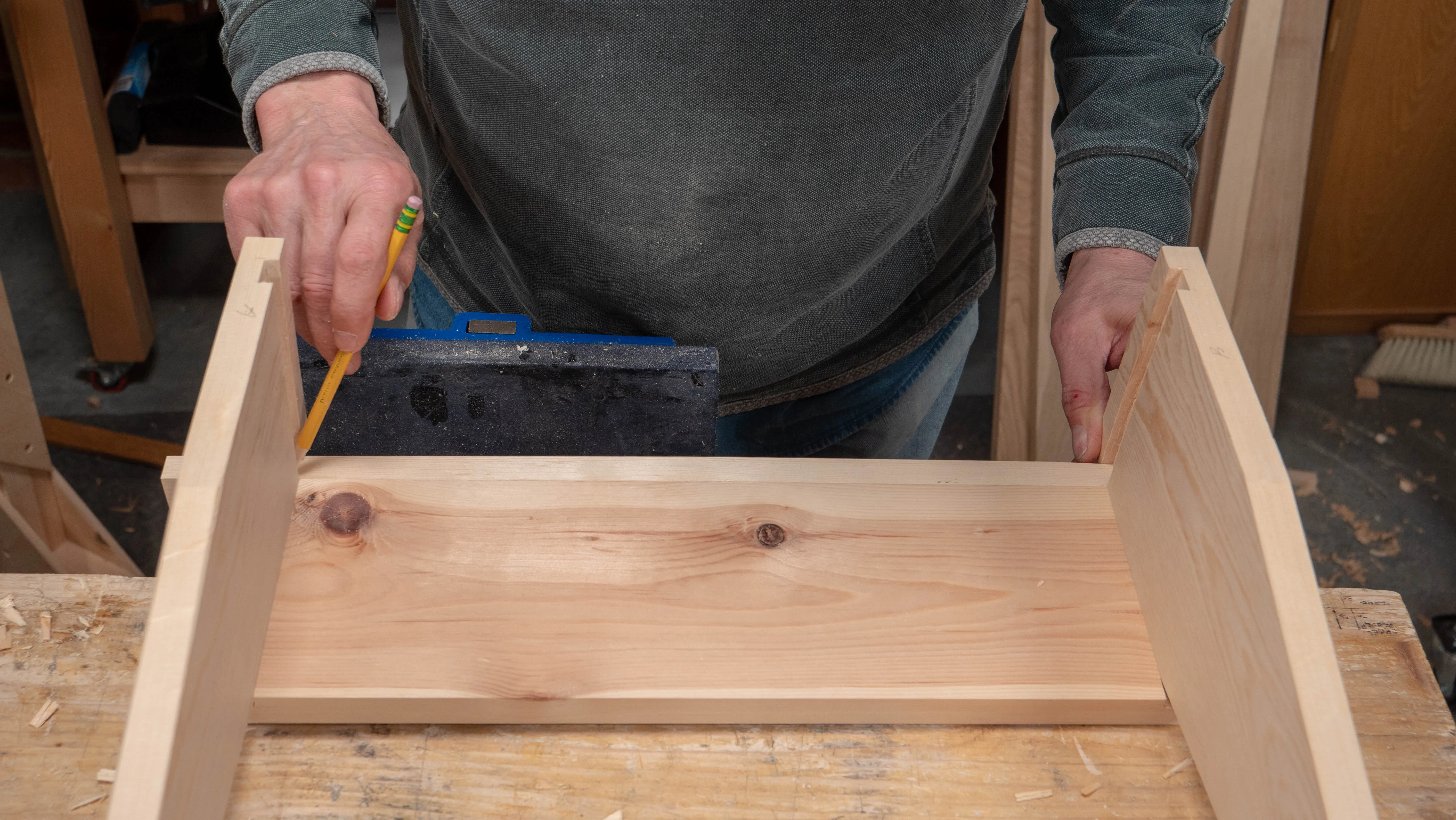 Assemble the ends to one side piece, as that will determine the distance between the end housings