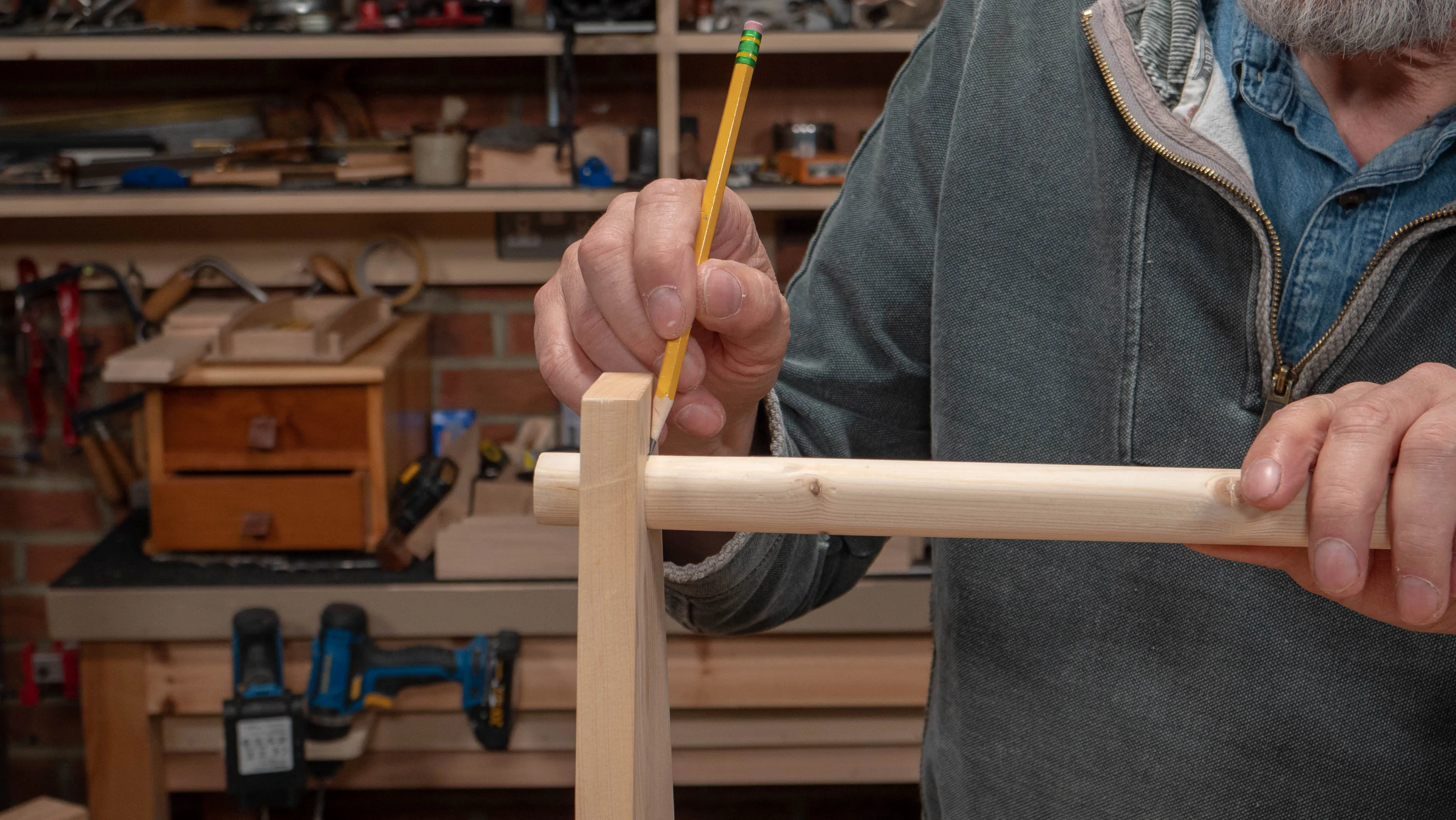 Mark the hole position on the top of the dowel at the intersection with the end pieces