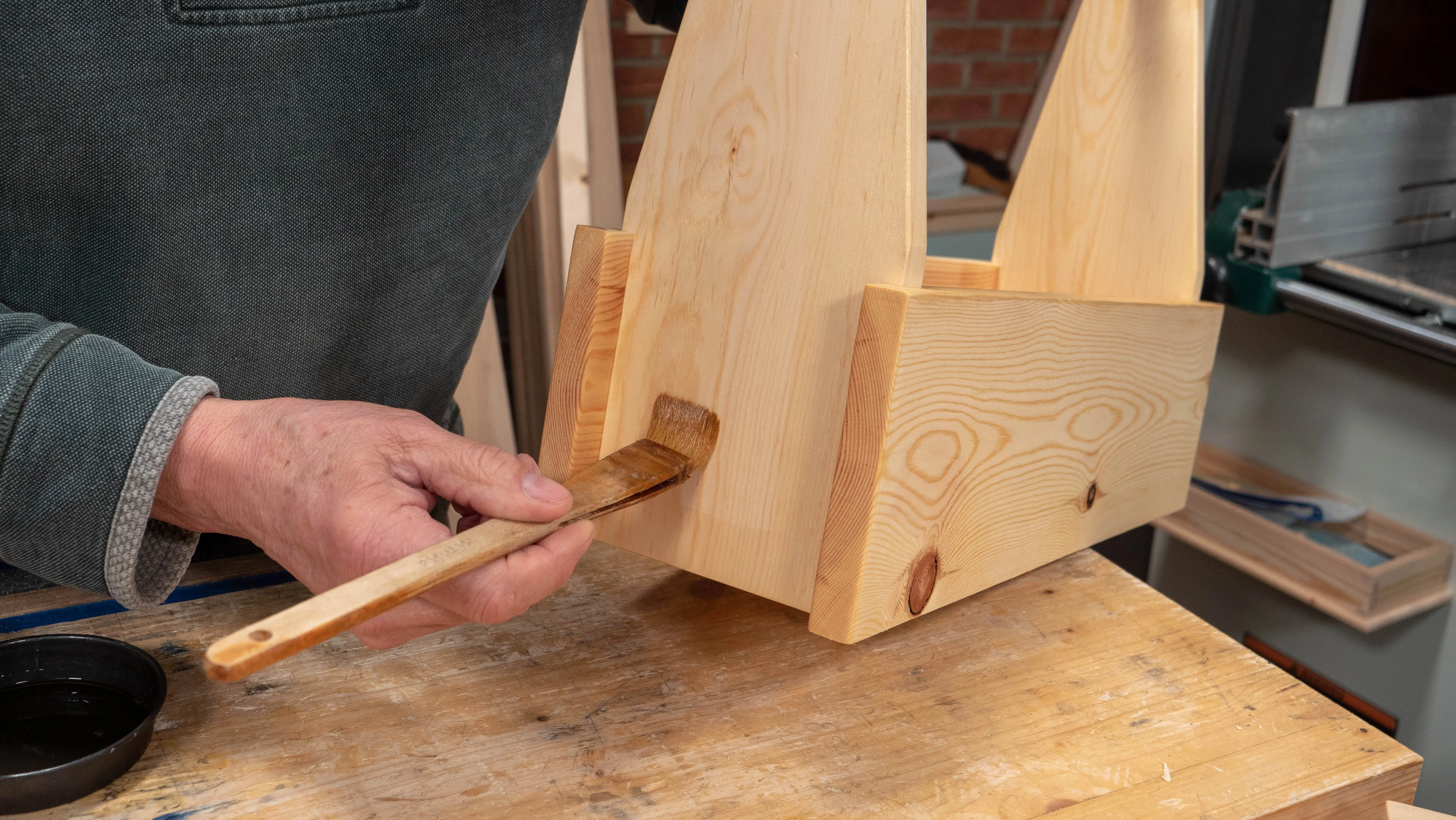 Go across the grain first and then even out with long strokes along the grain