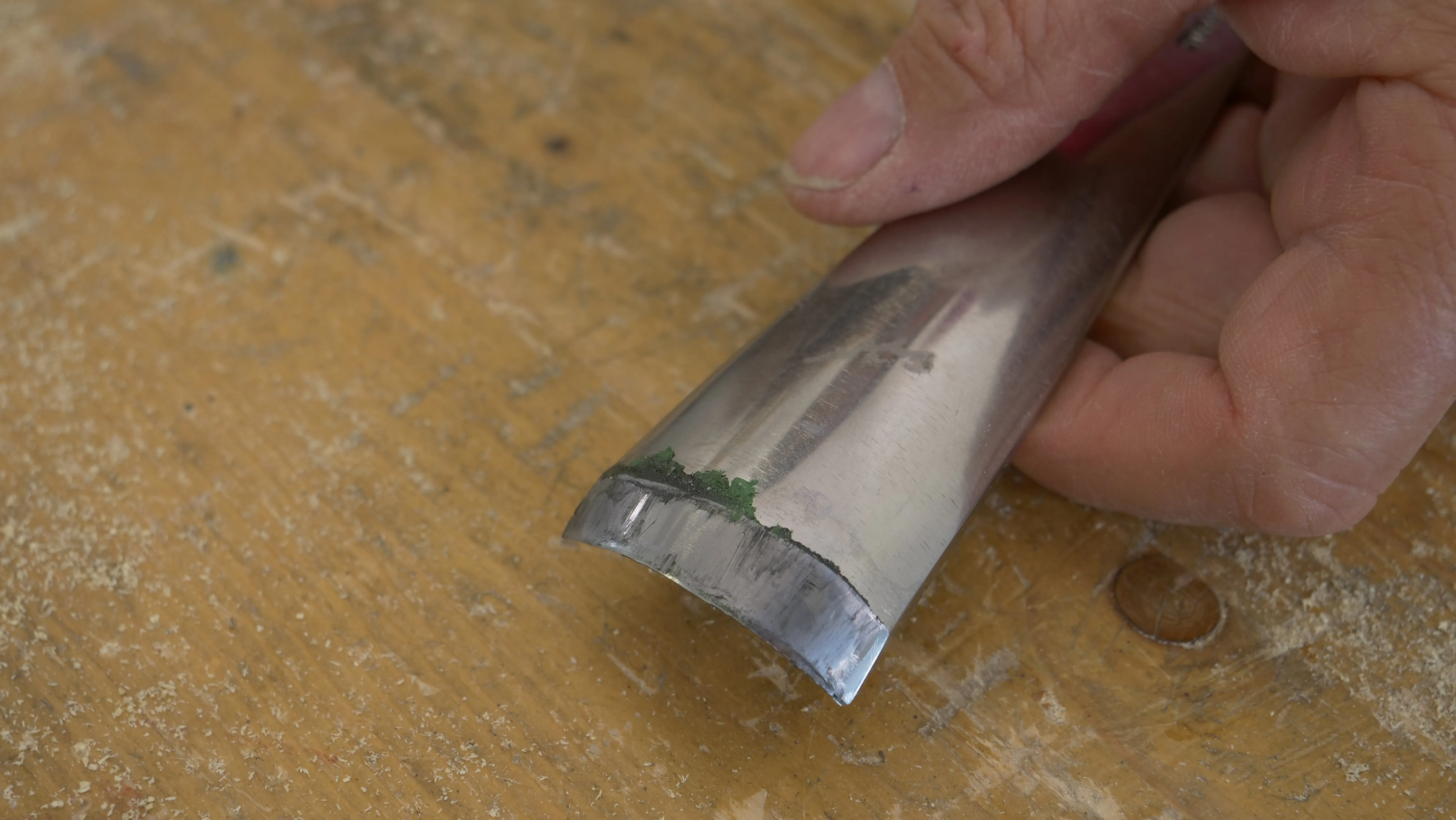 Stropping the outside of the gouge. Wipe away any excess compound from the gouge with a tissue.