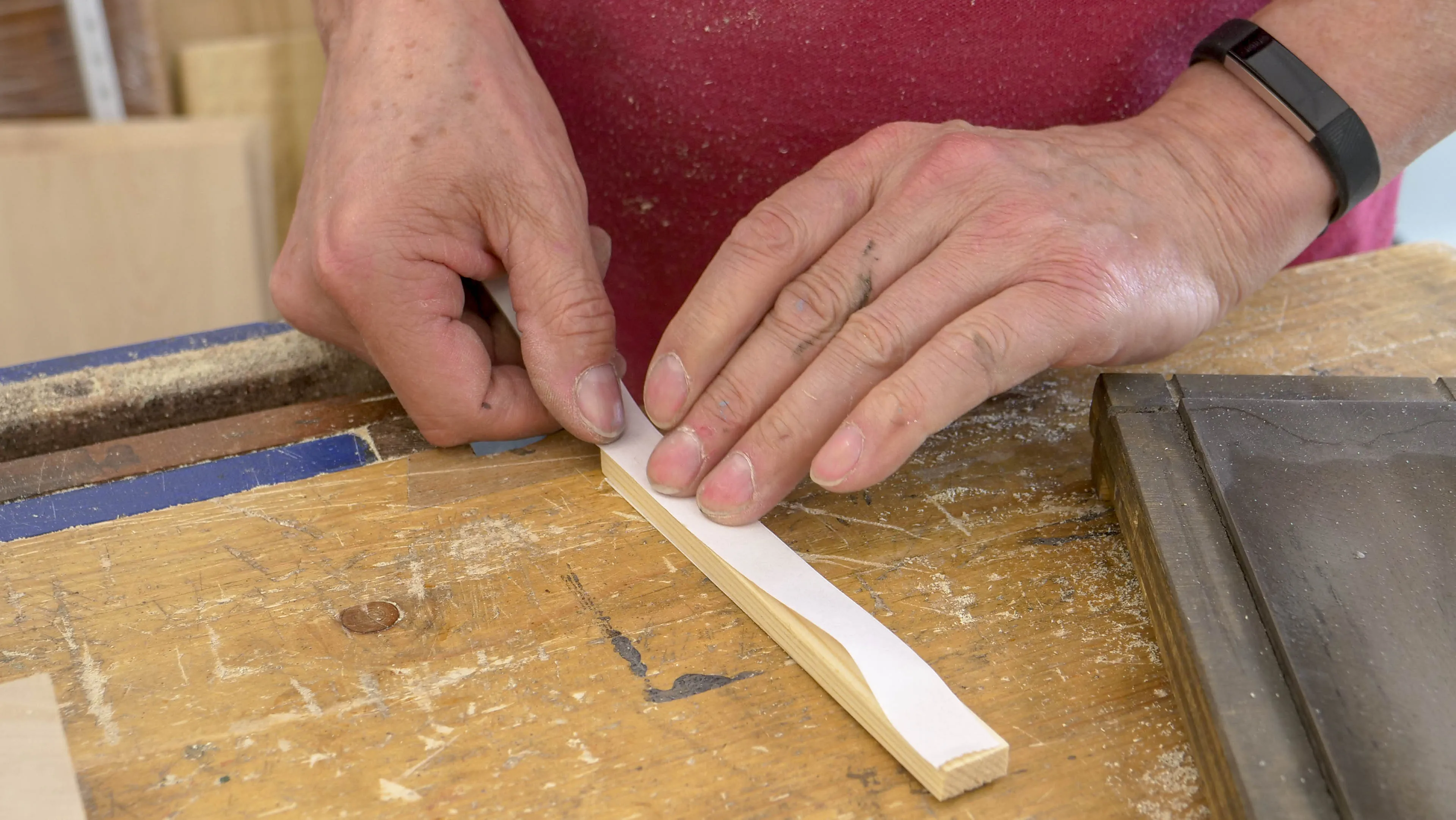 Stick double sided tape to either side of your piece of wood
