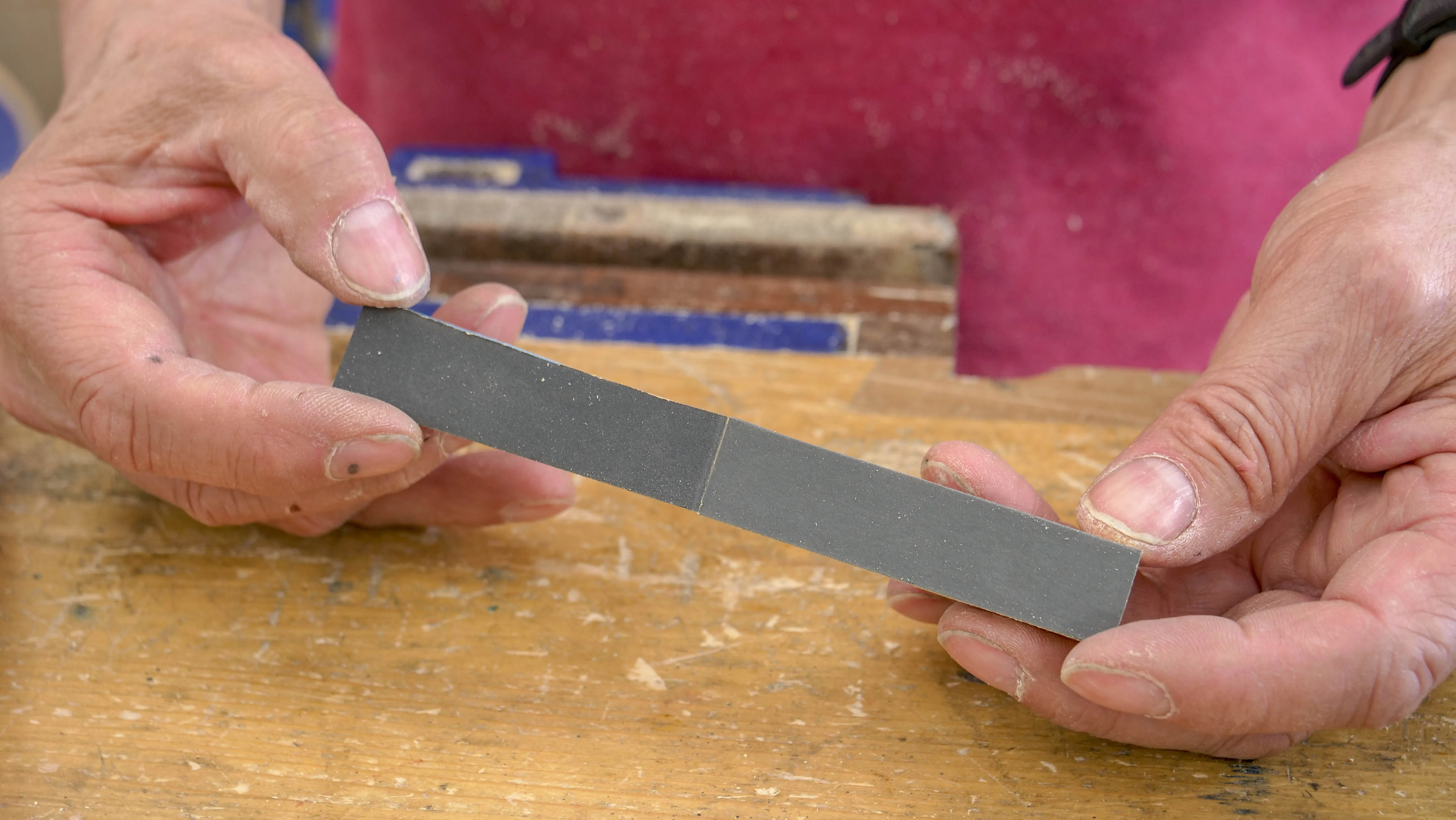 Use 4 different grades of abrasive paper and cut to half the length of the strip of wood, peel back the double sided tape and stick on the abrasive paper