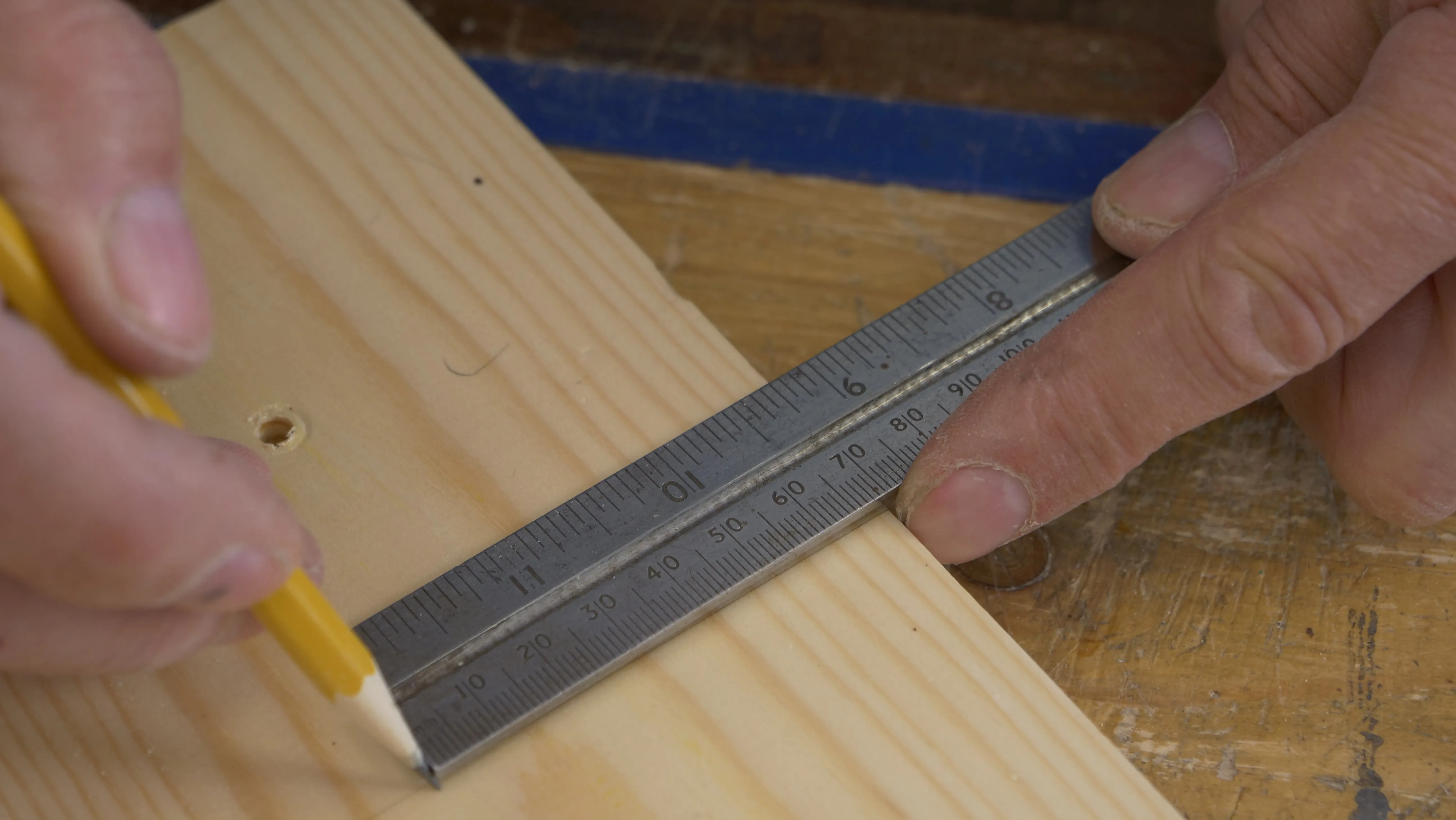 Mark seven increments from the edge. 70mm will work fine.