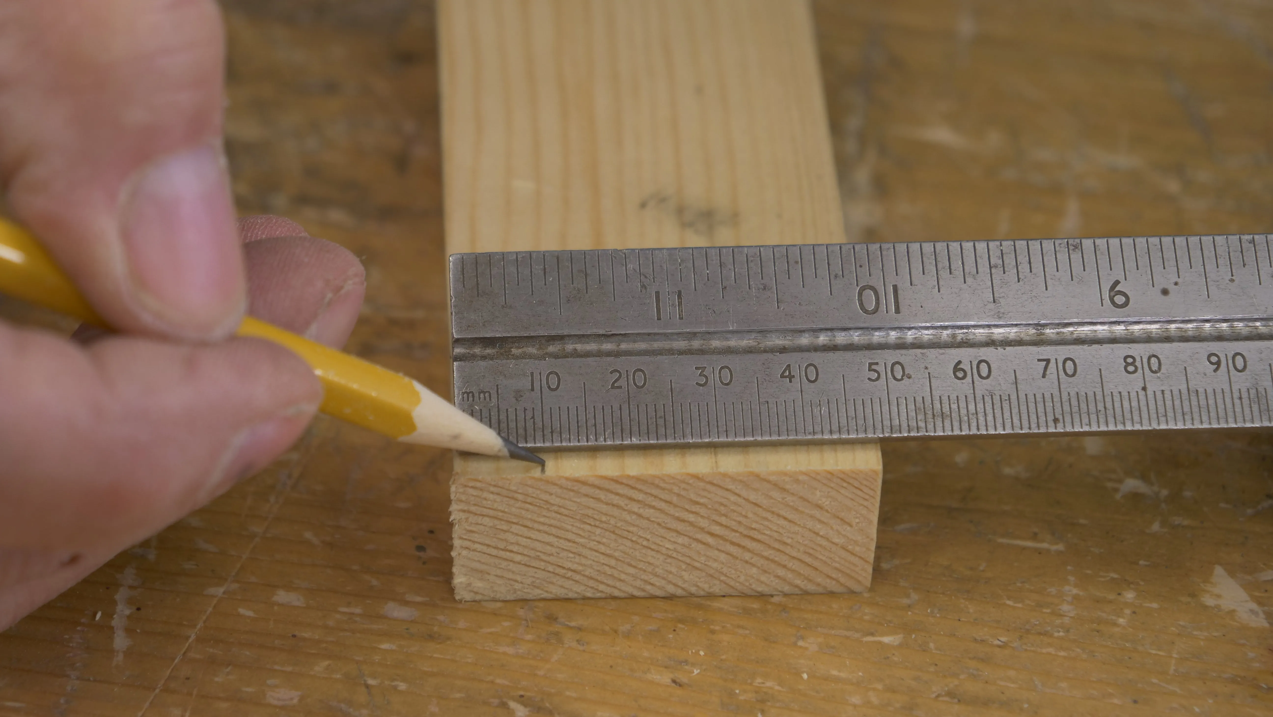 On the end of the tail piece, measure 10mm from the ends and make a small mark