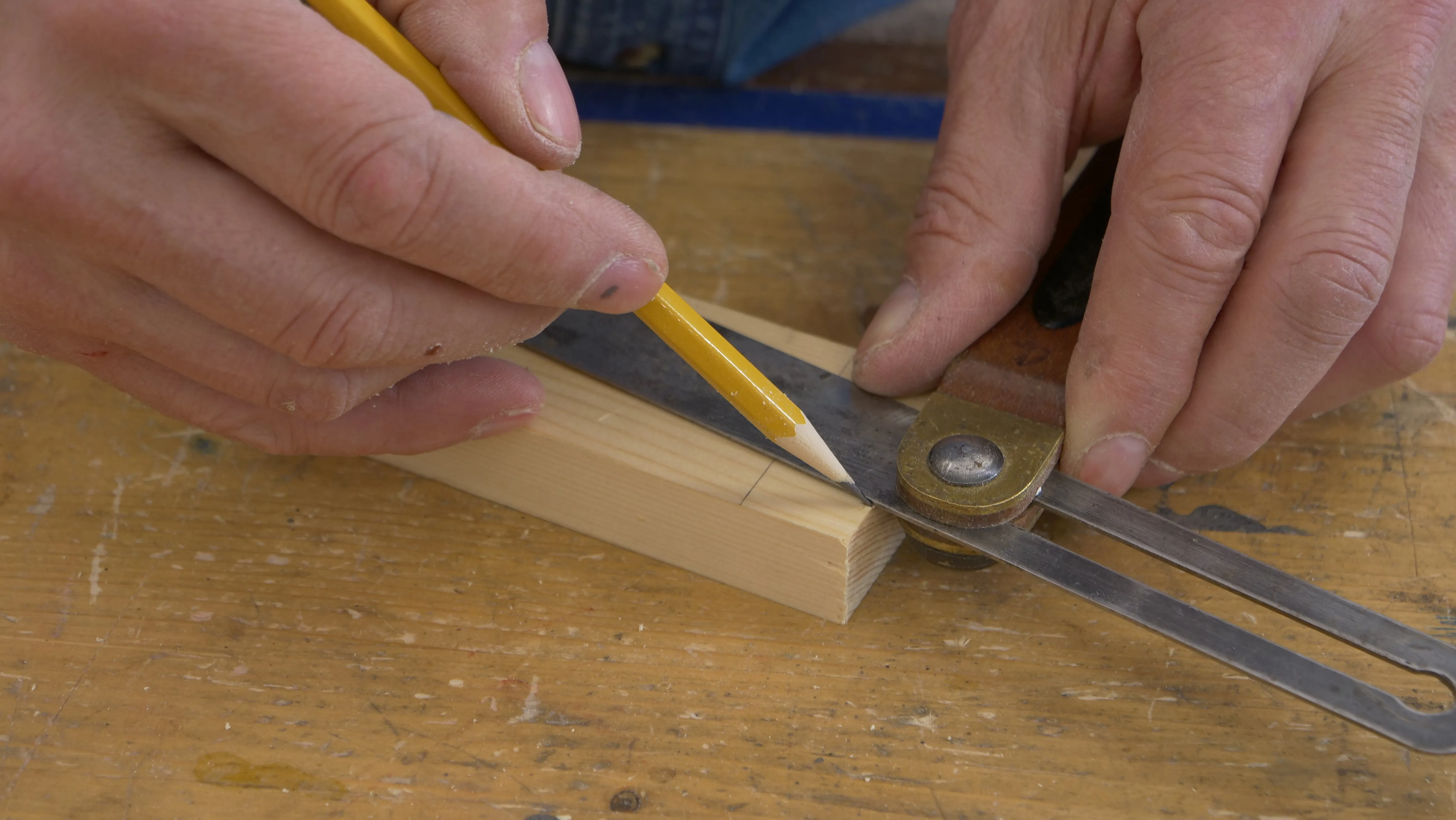 Lay out the cut lines on the sides using a sliding bevel set to a 1:7 angle
