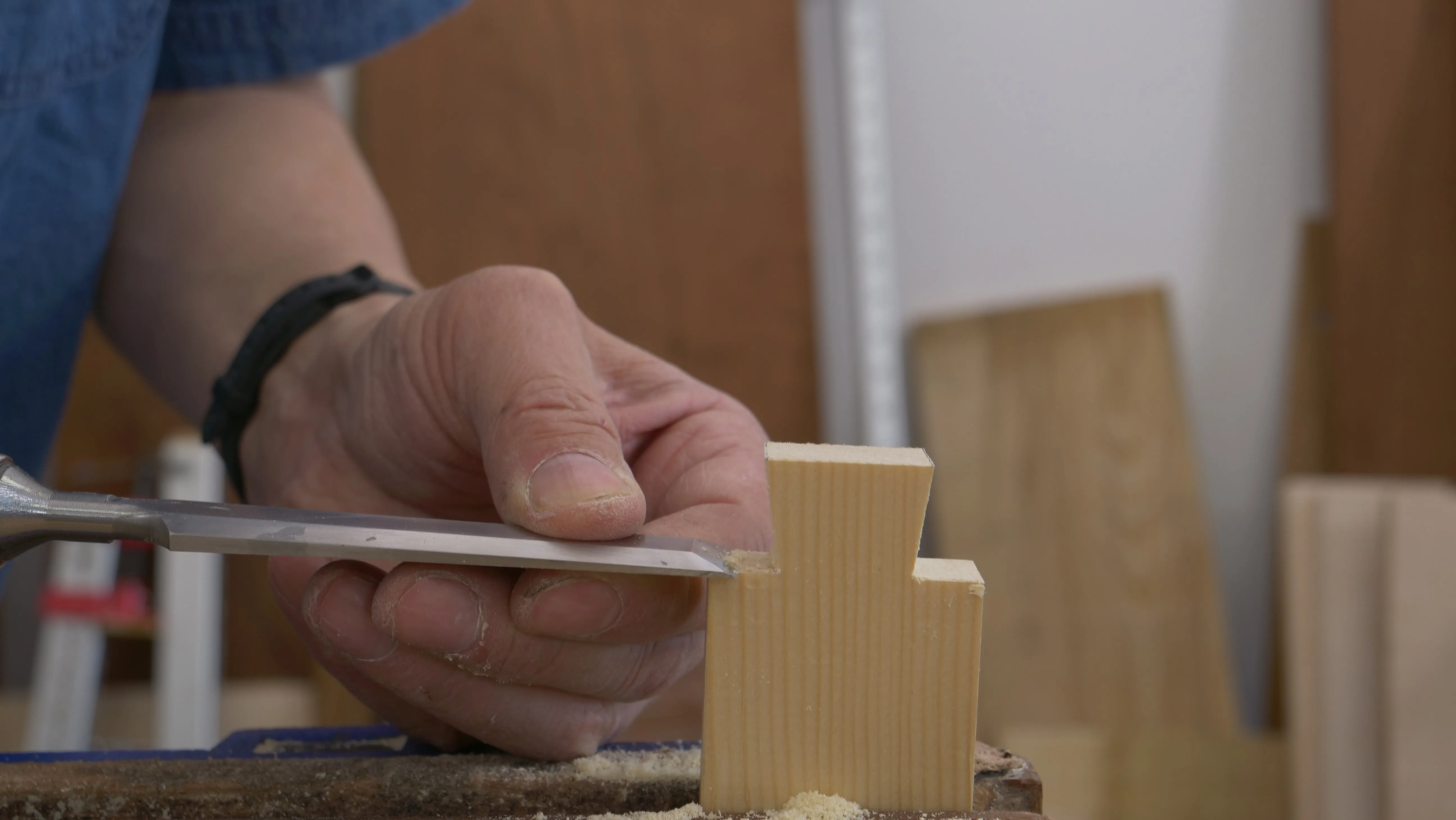 Clean up the shoulders with a sharp chisel. Do not cut below the shoulder line