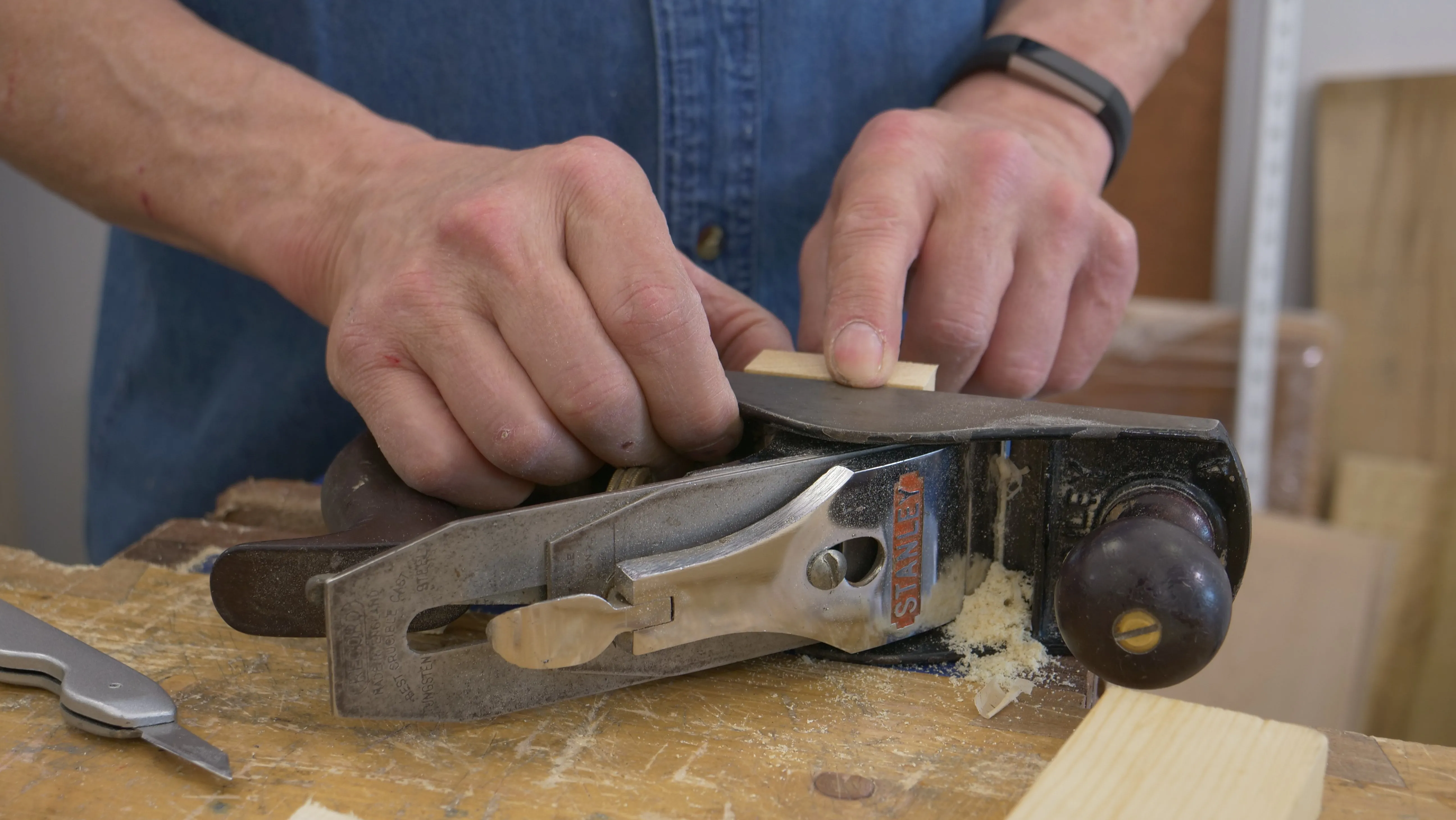 Lay your plane on its side and flush the top of your pin piece with it before clamping tight