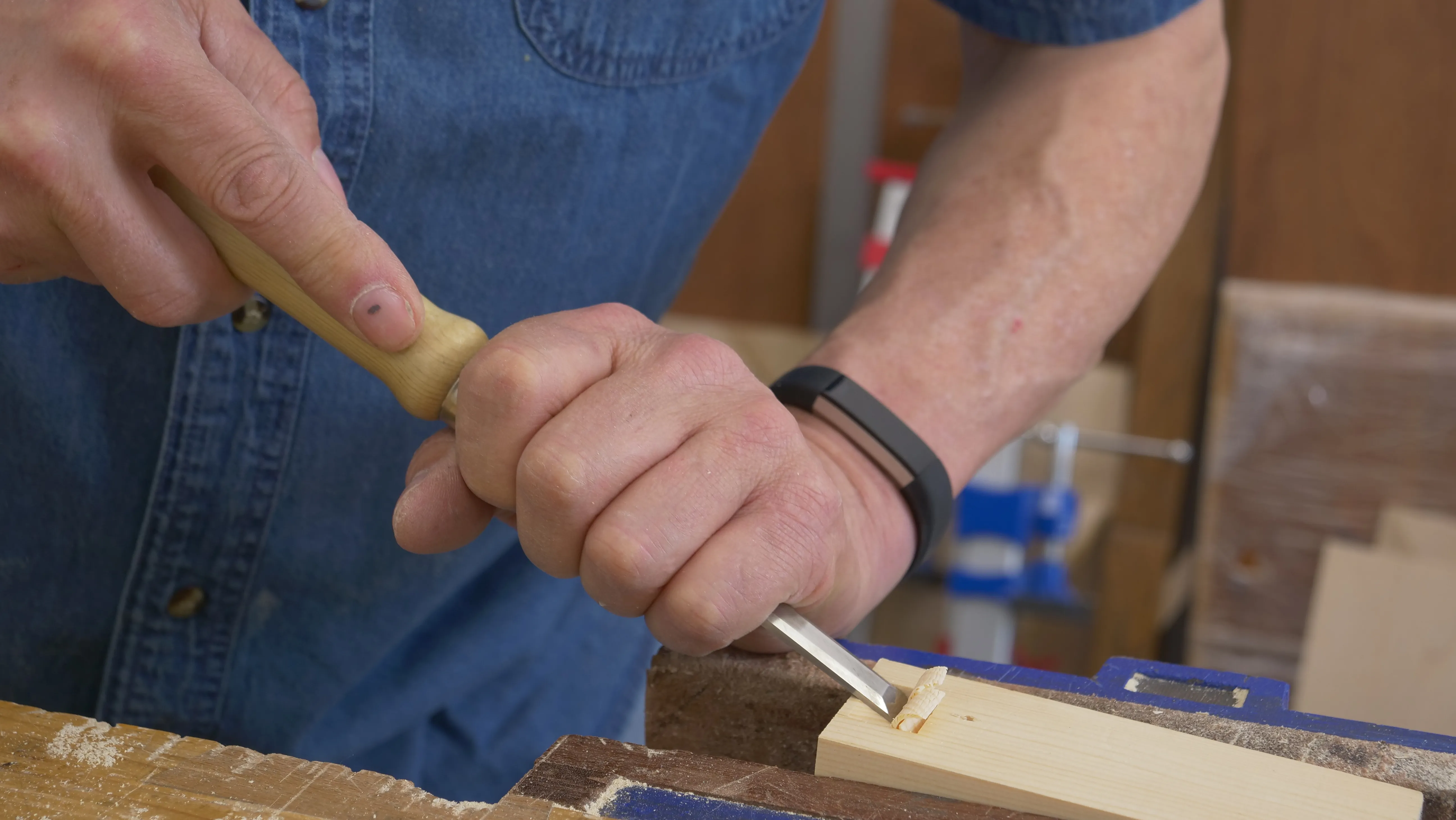 Clamp securely and slice down with the chisel to make room to chop deeper. Use a chisel hammer if necessary.