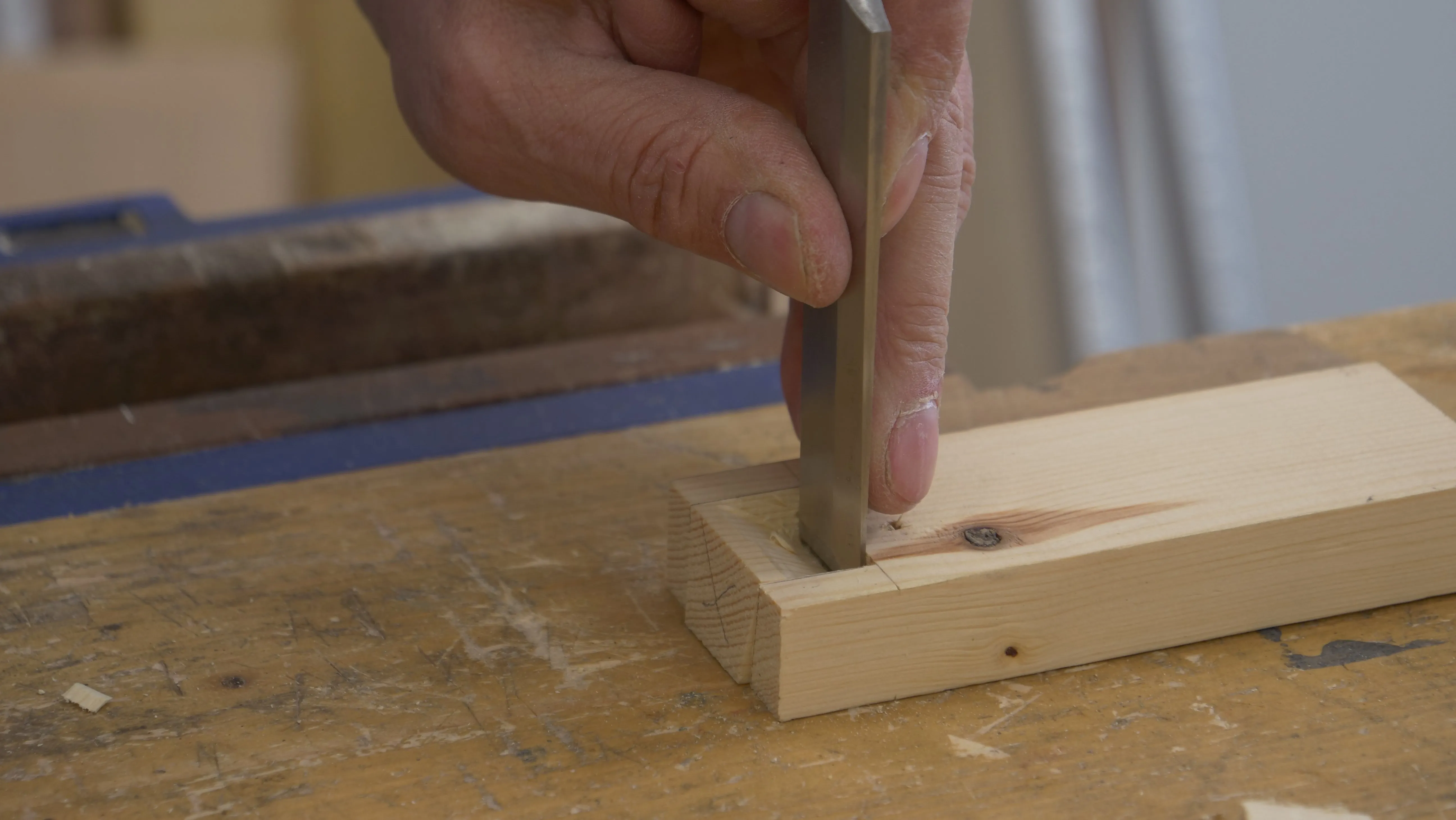 Choke up on your chisel when you're about to break through