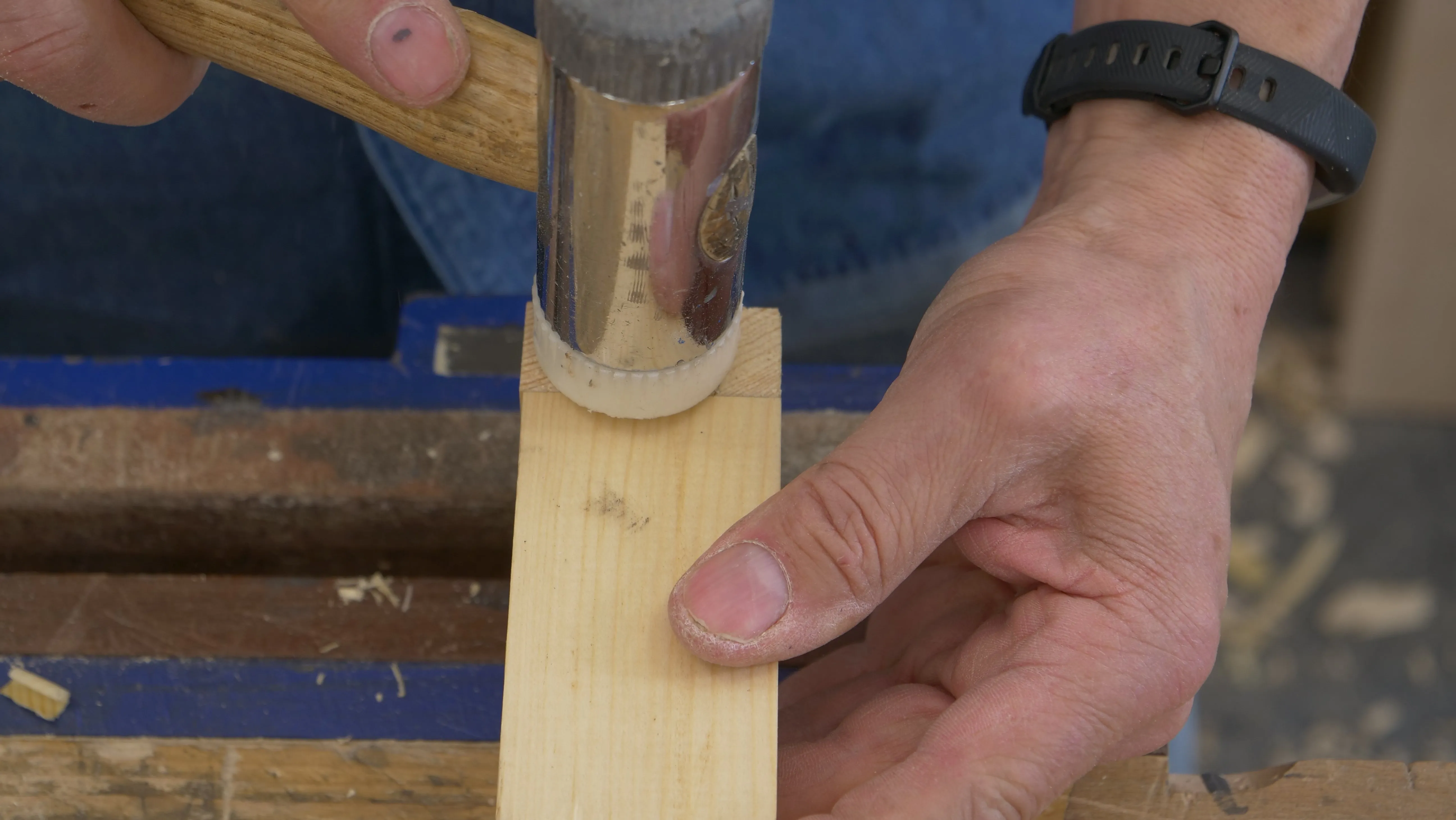 Tap the dovetail with a chisel hammer to close up the shoulders