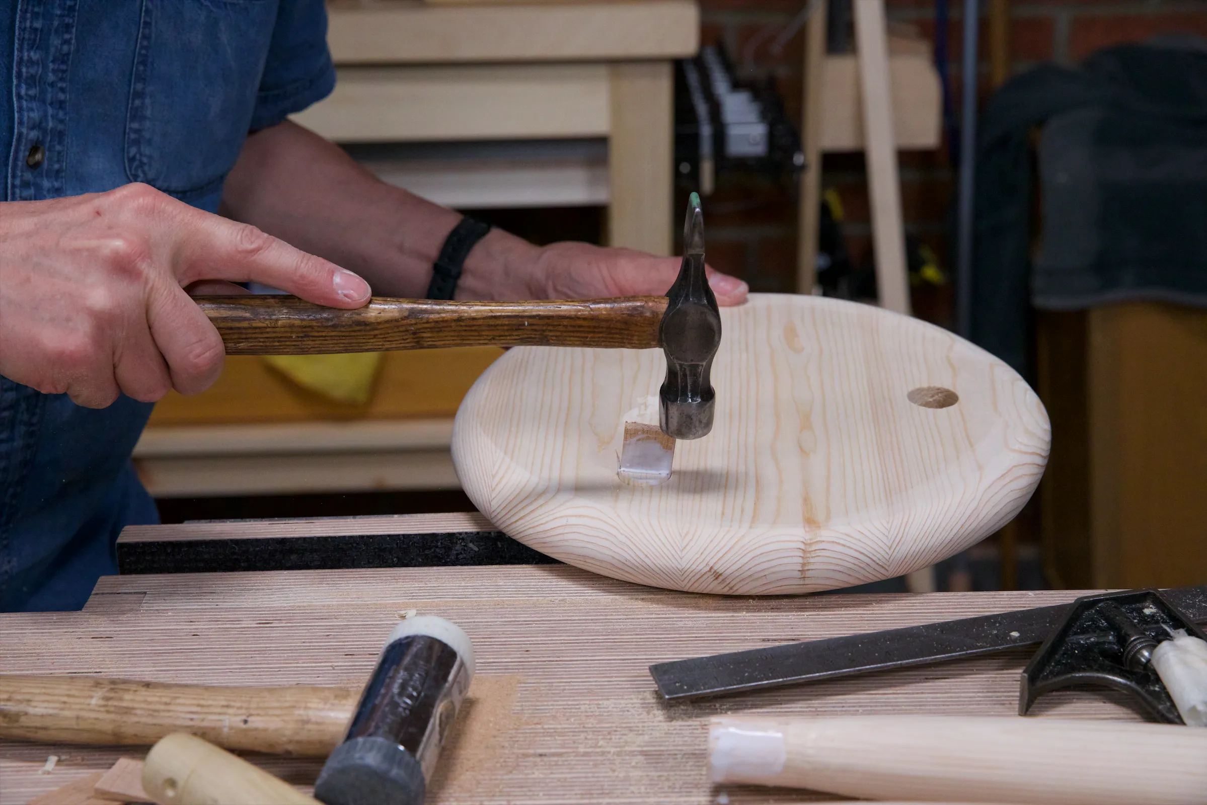 Carefully insert the glued wedge in the saw kerf and drive with a steel hammer